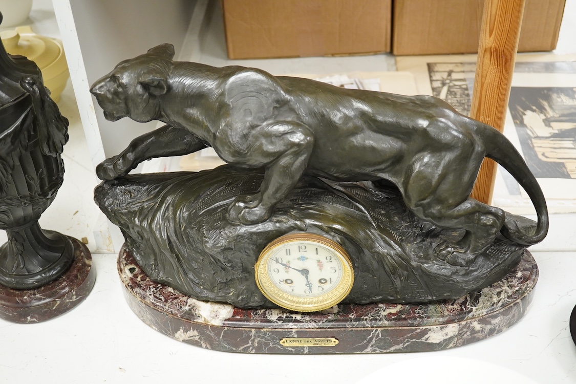 A clock garniture signed Boffil, ‘Lionne aux Agnets’